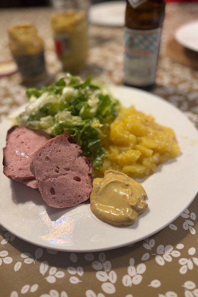 Gebackener Leberkaese mit Kartoffel und Endiviensalat